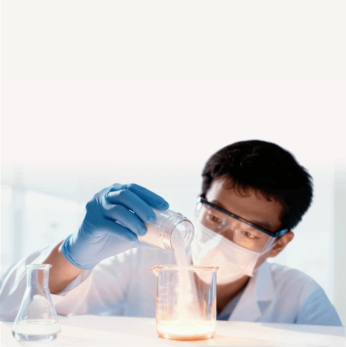 Lab technician preparing a supplement formula